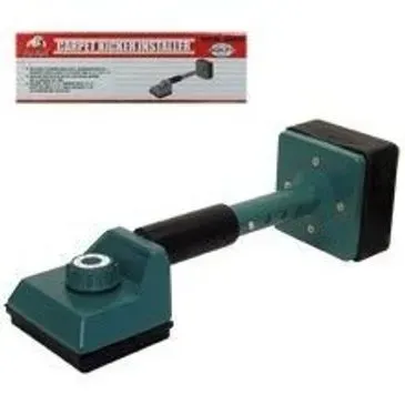 Green and black carpet kicker tool with box in background.