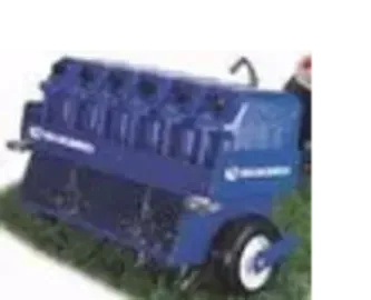 Blue lawn aerator with wheels on green grass.