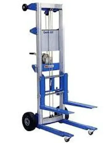 Blue and silver Genie Lift, with forks, raising equipment, indoors.