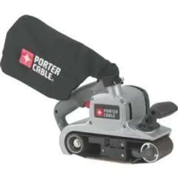 Porter-Cable belt sander with black dust bag. Silver body, gray handle, and red accent button.