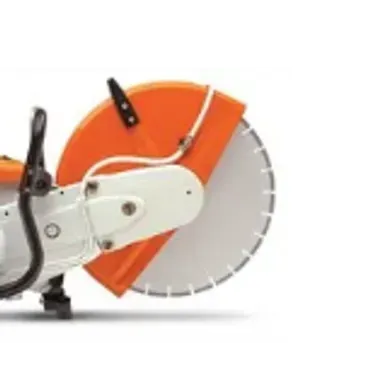 Orange and white concrete saw with a large blade.