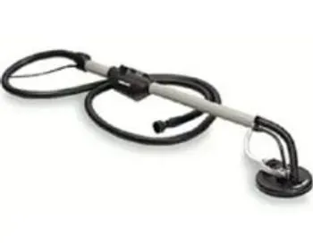 A long-handled drywall sander, black and gray, lying on a white surface.