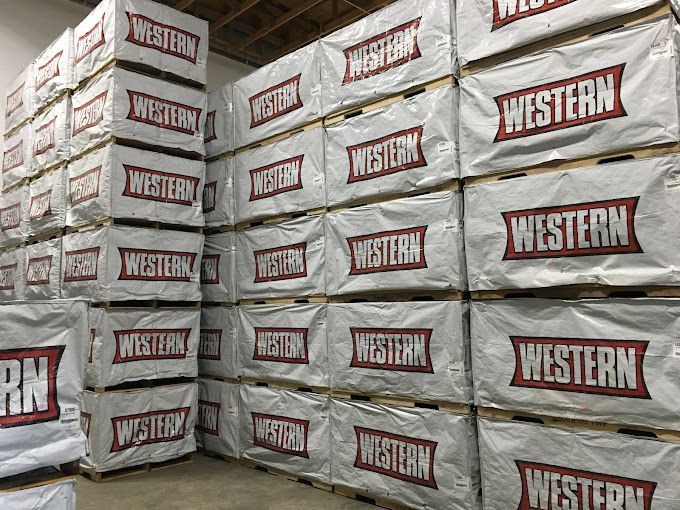 A warehouse filled with lots of boxes stacked on top of each other.