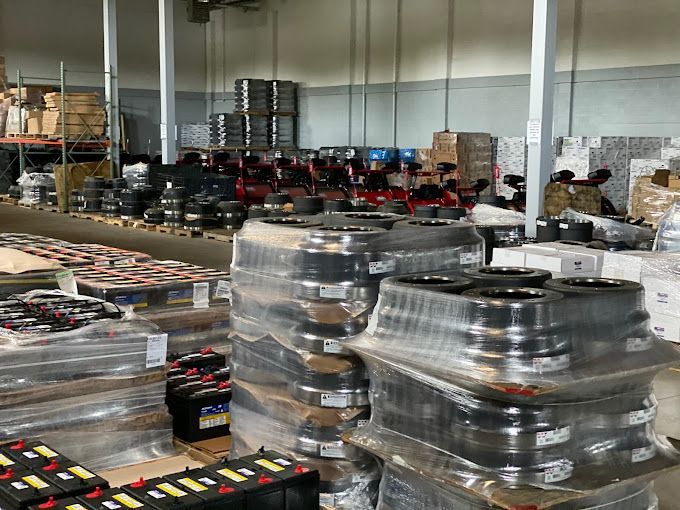 A large warehouse filled with lots of batteries and boxes.