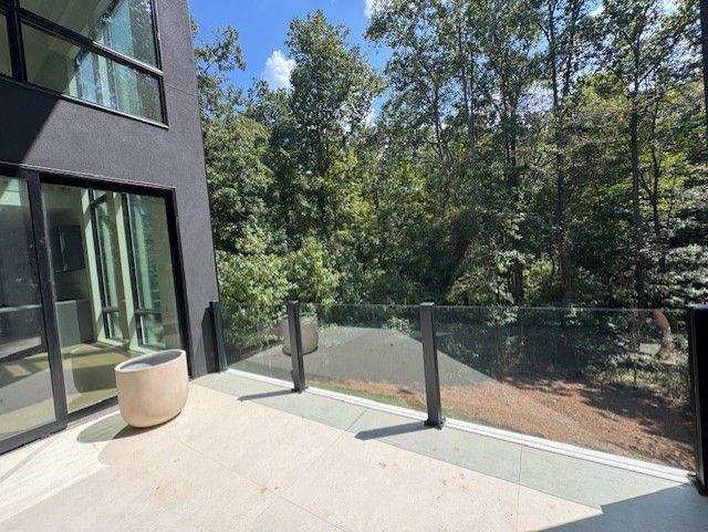 Modern balcony with glass railing 