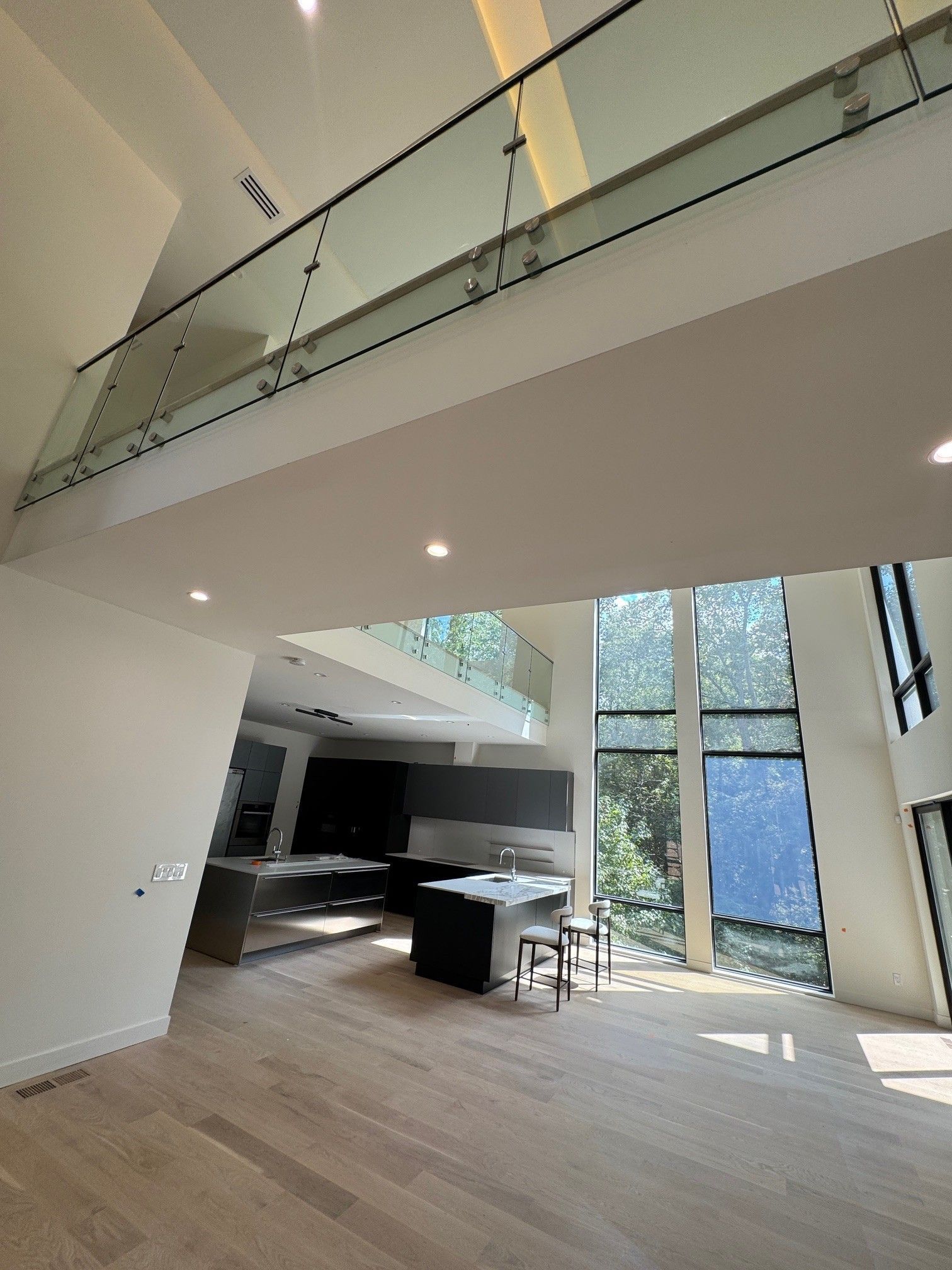 Modern home interior with a second-floor balcony