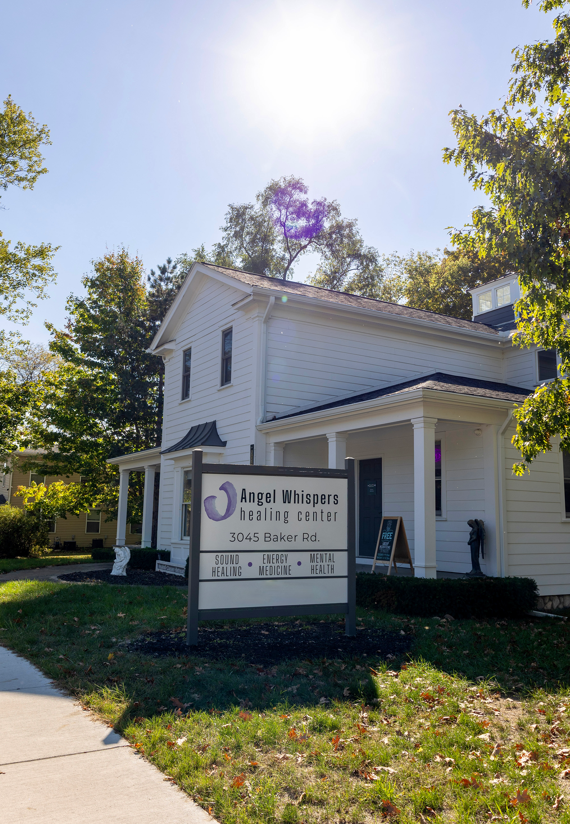 White building with sign for 