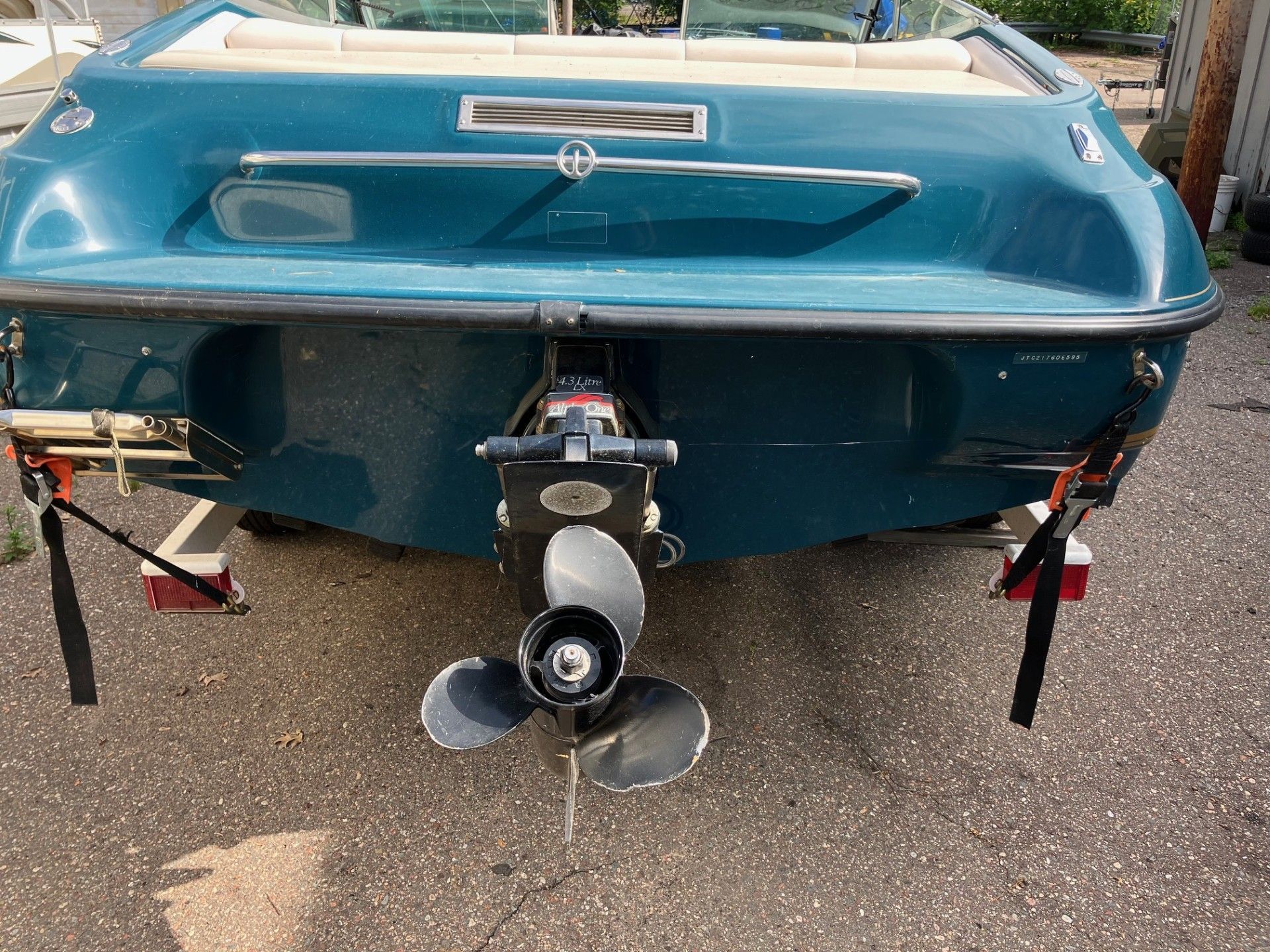 A blue boat with a propeller attached to it