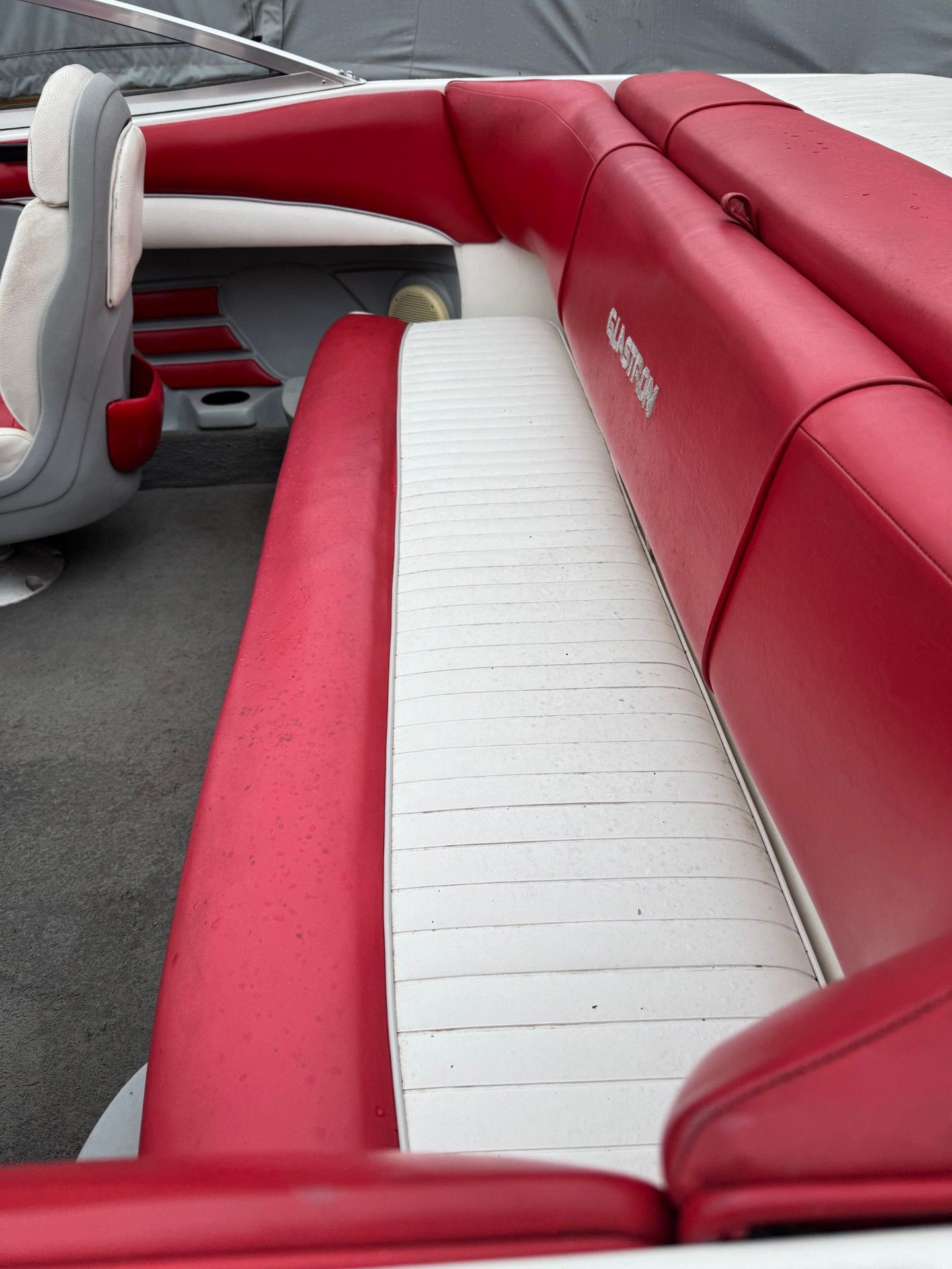 A red and white boat with the word o'neill on the back