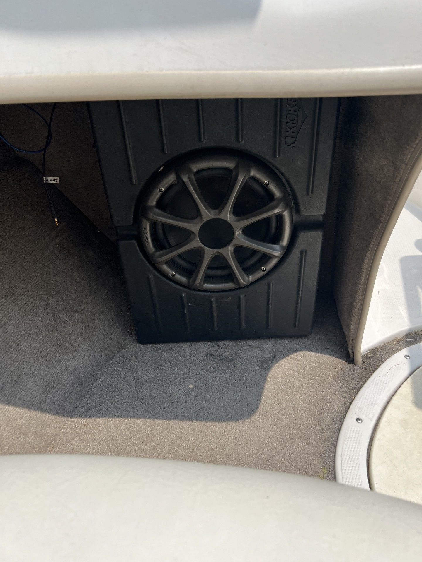 a speaker is sitting in the back of a boat