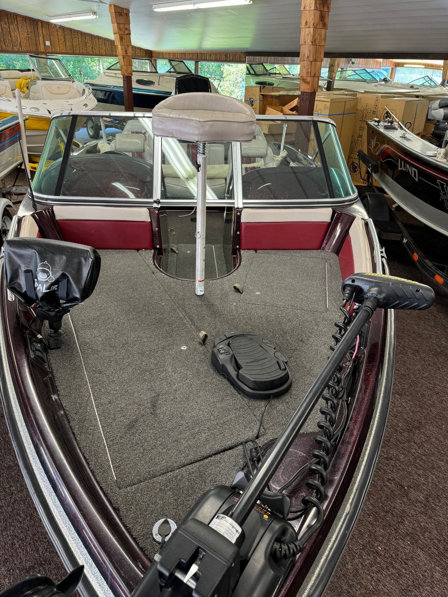 A fishing boat is sitting in a showroom