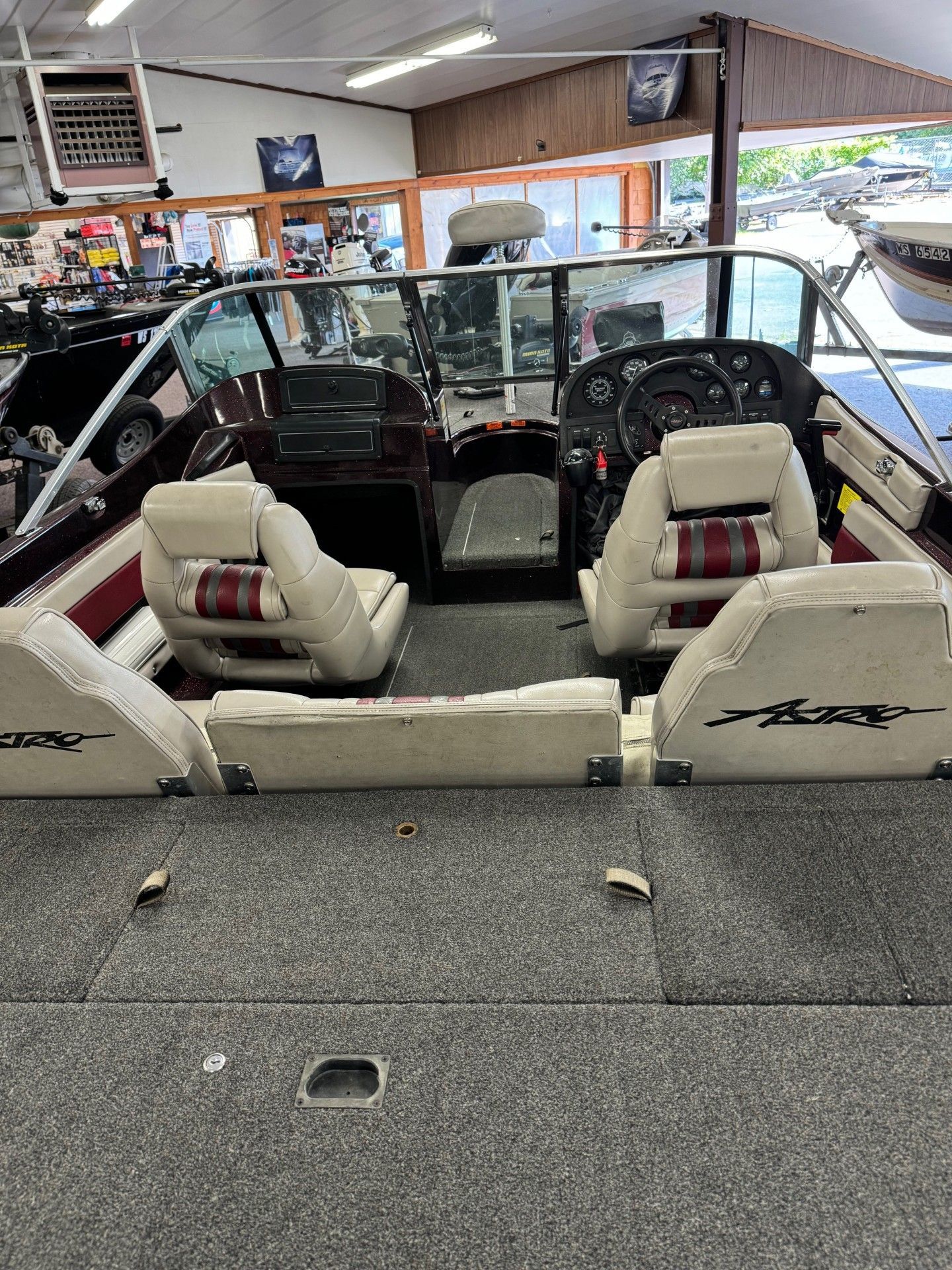 The inside of a boat is shown in a showroom