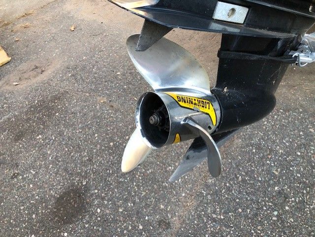 Close up of a boat propeller on the ground