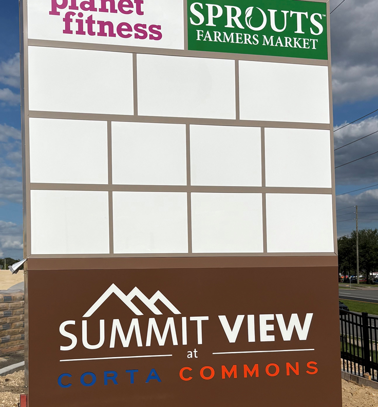 Summit View at Corta Commons sign with Planet Fitness and Sprouts Farmers Market logos.