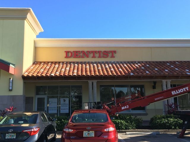 Exterior of a dentist office with red 