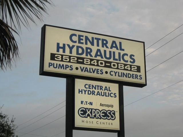 Sign for Central Hydraulics, with phone number, pumps, valves, and cylinders listed. Also Express Hose Center.