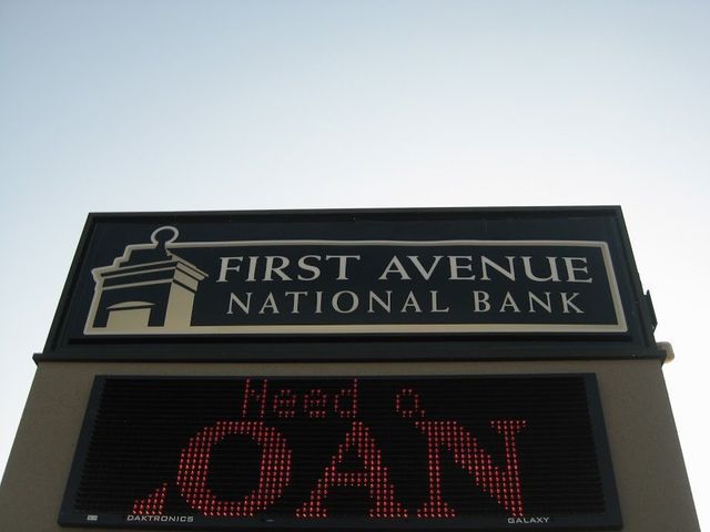 Sign for First Avenue National Bank with a display that reads 