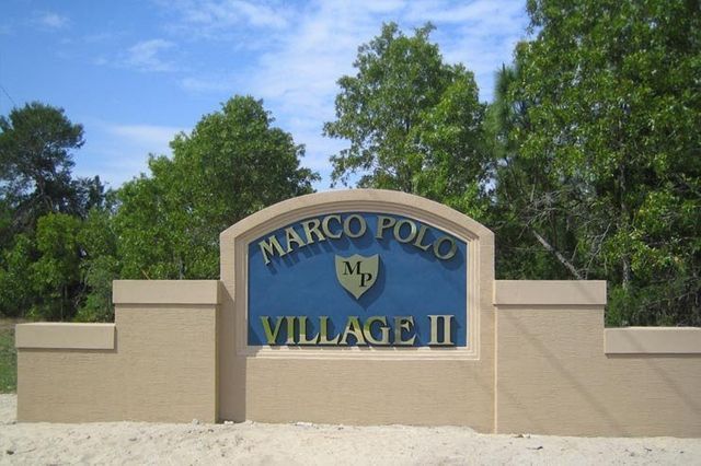 Sign for Marco Polo Village II with blue background and beige accents.