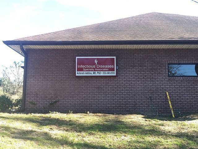 Brick building with a sign for 