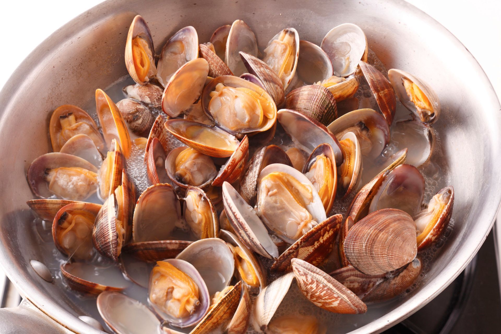 A wooden table topped with plates of food and drinks