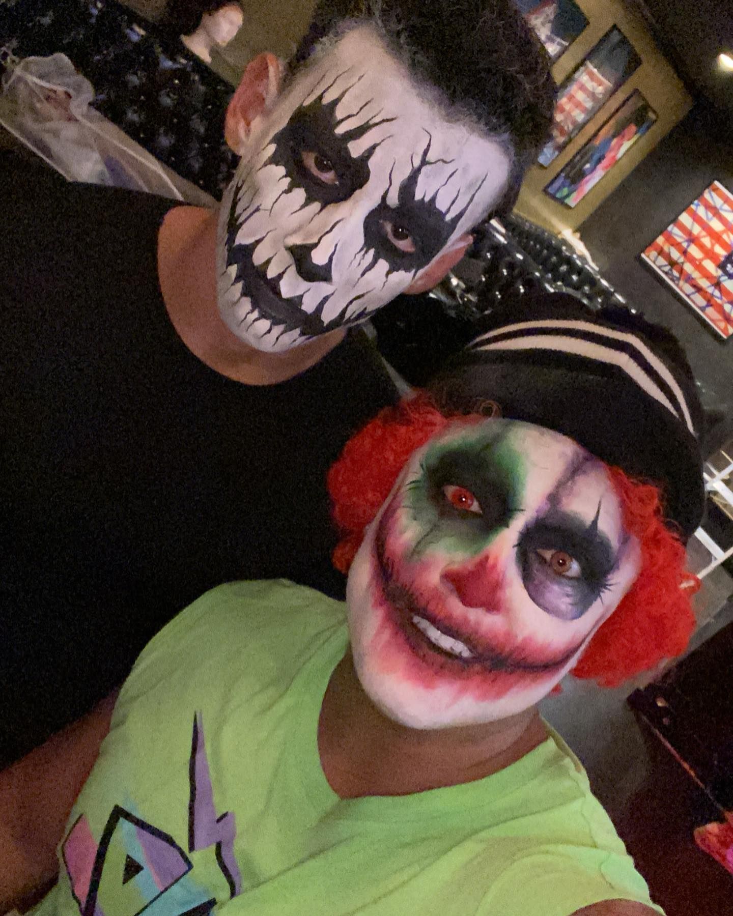 A man and a woman with face paint on their faces