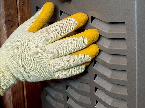Hands wearing repair gloves
