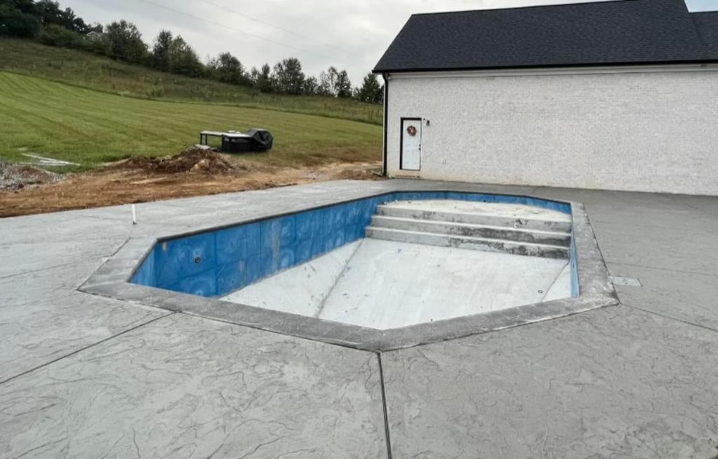 a swimming pool is being built in the backyard of a house