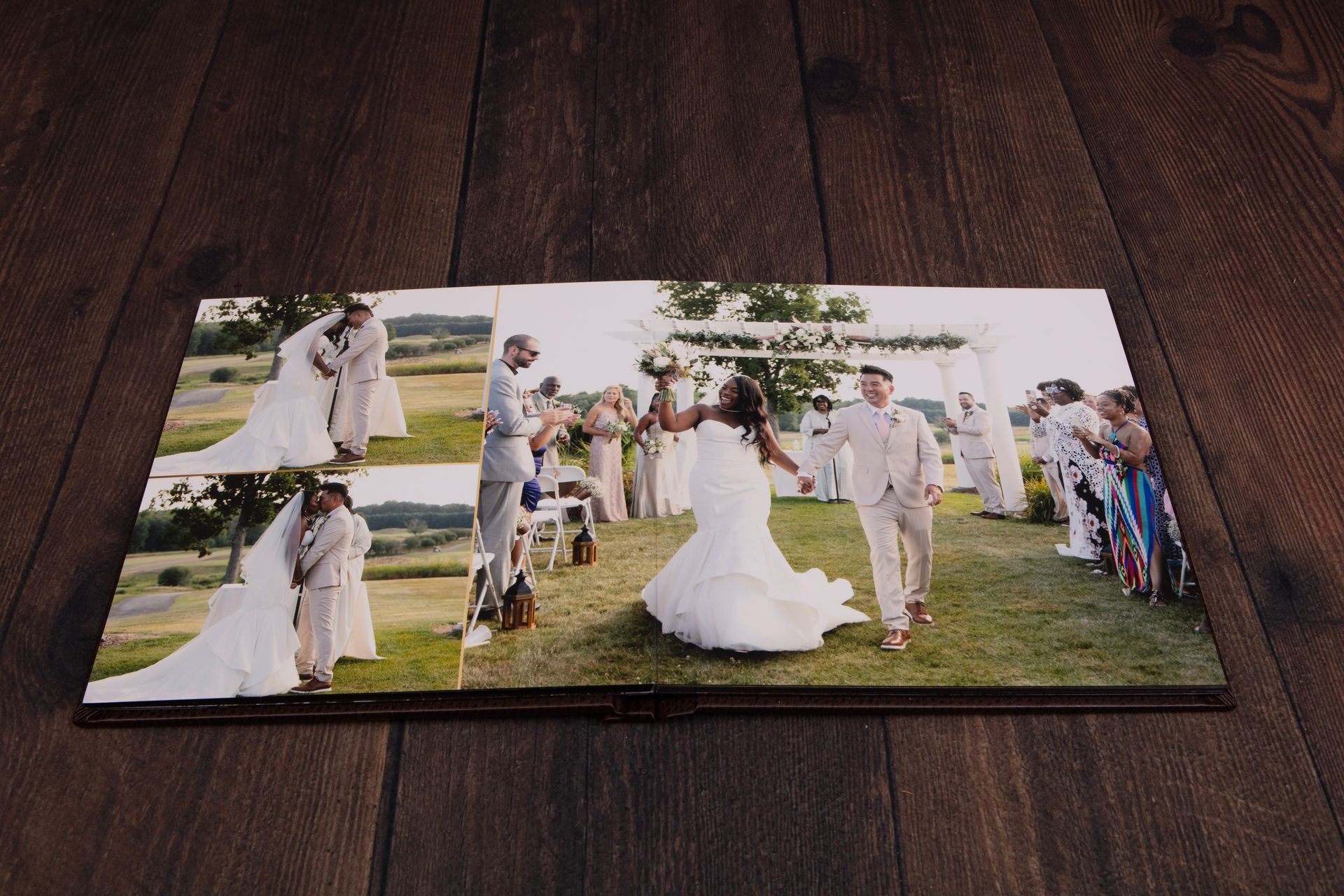 Wedding album open to show bride and groom, family and friends, outdoors.