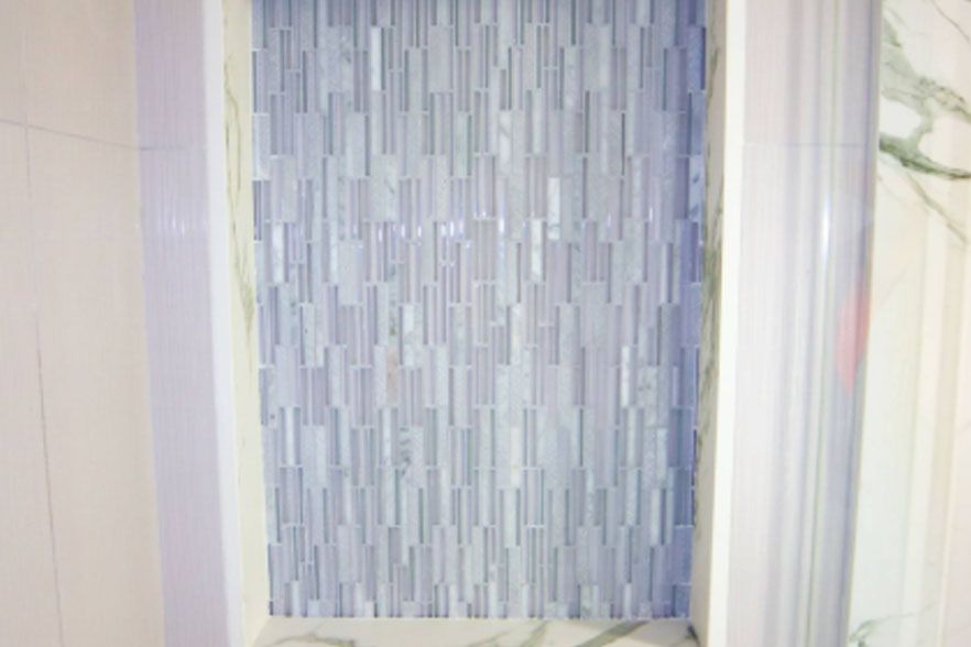 Textured blue-and-white patterned panel between light curtains
