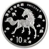 Black commemorative coin with a white unicorn and Chinese text, marked 10 yuan.