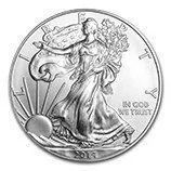 A silver U.S. coin with a standing Liberty figure and the words “IN GOD WE TRUST.”