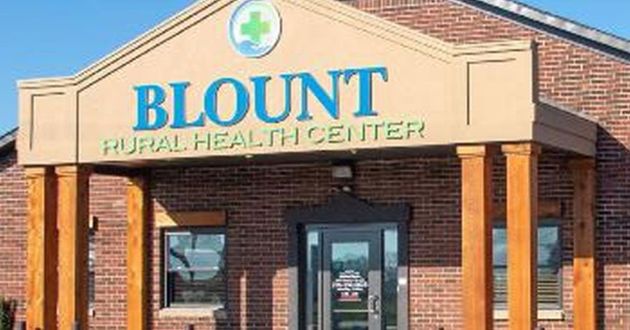 Blount Rural Health Center storefront with brick facade and blue-green signage