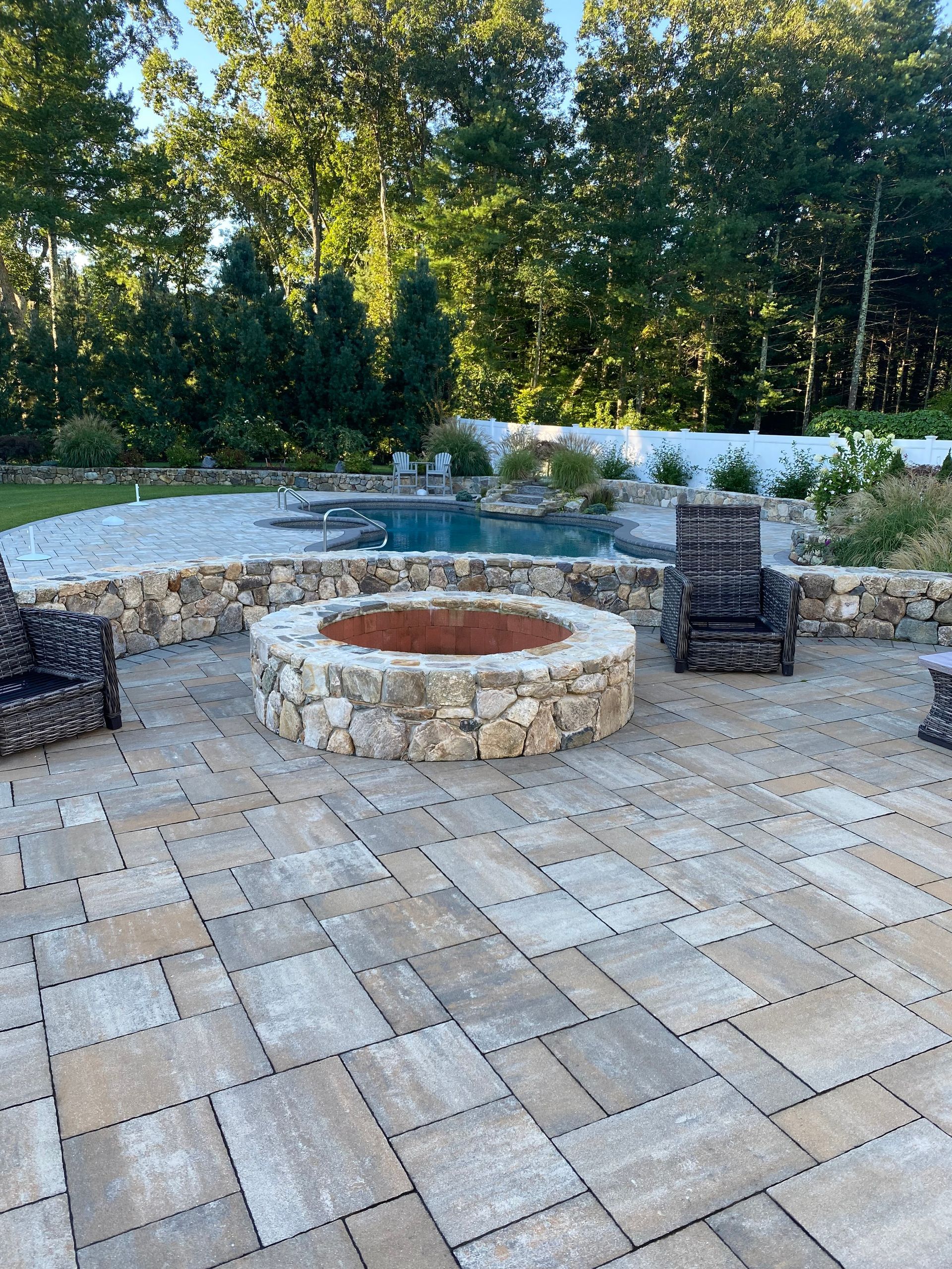 There is a fire pit in the middle of the patio.