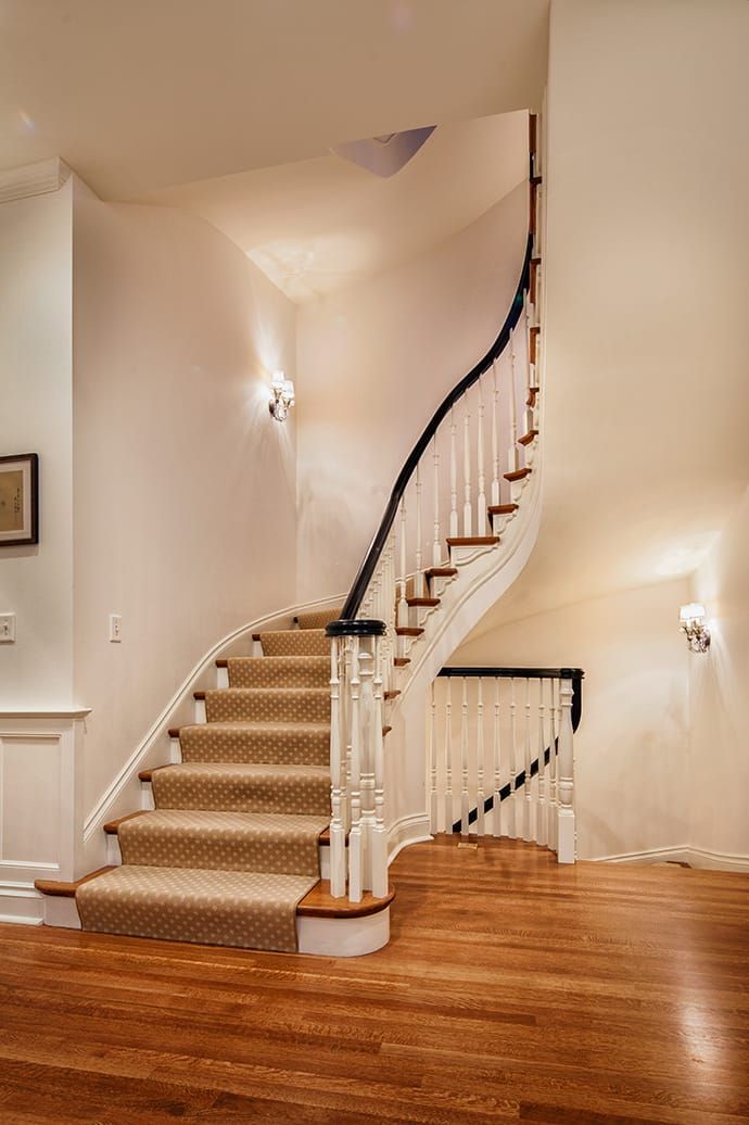 Newly remodeled interior with stairway and hardwood floors