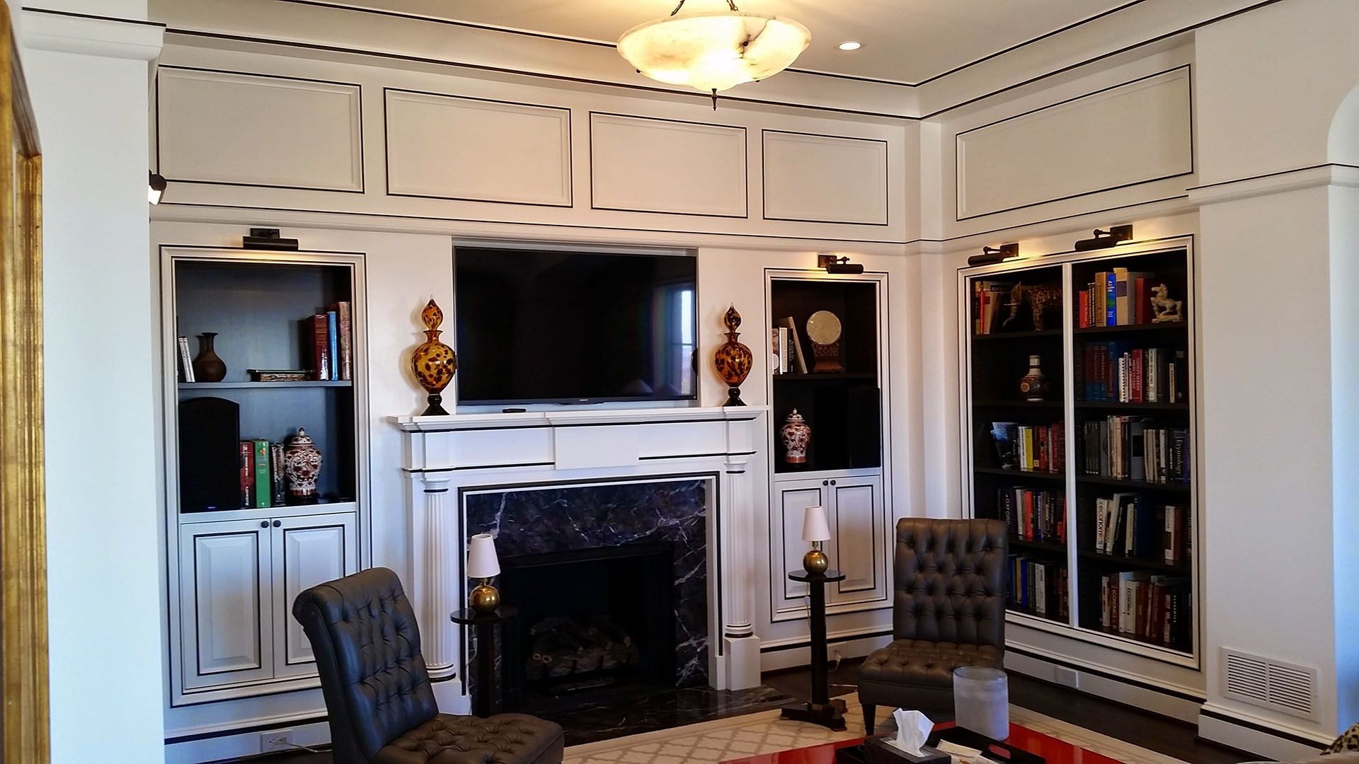 White paneled room with fireplace