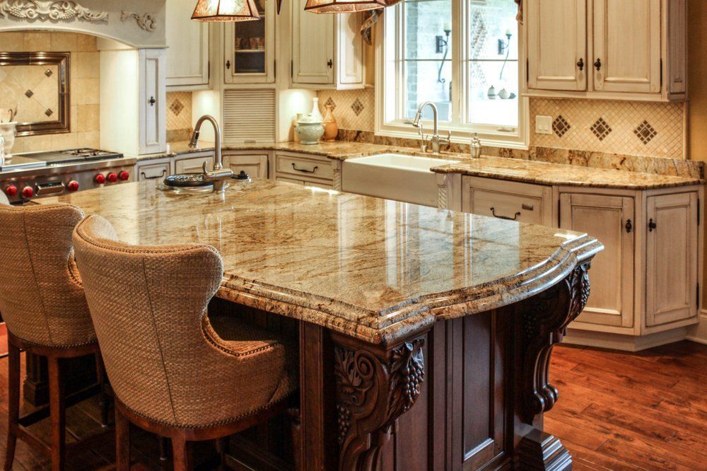 There is a large island in the middle of the kitchen.