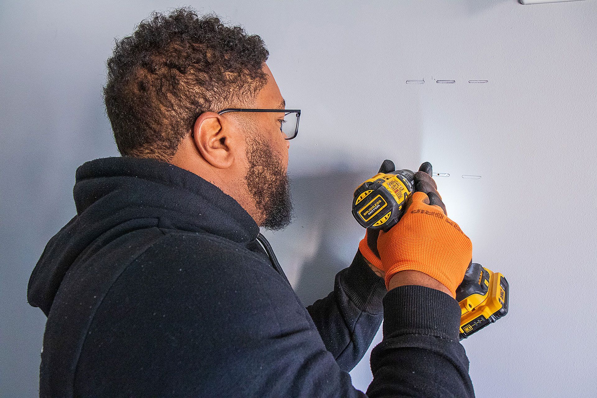 man drilling the wall