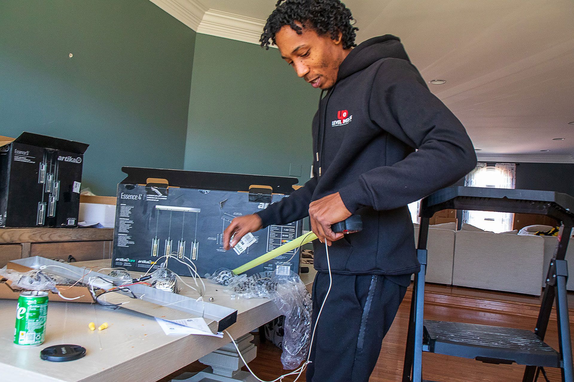 man working on the new lighting fixture