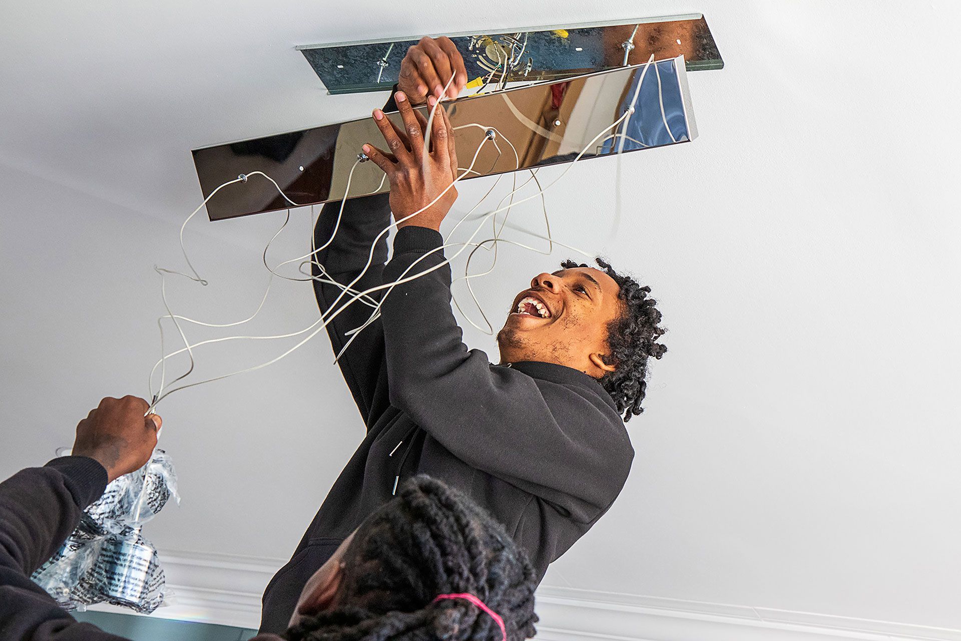 man installing the ceiling lights