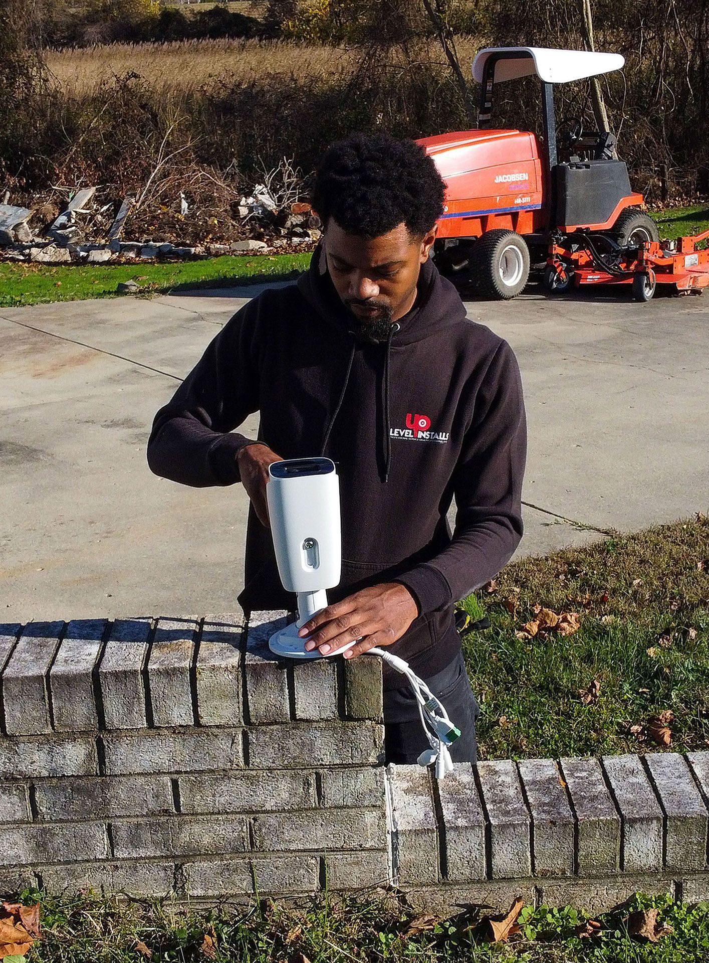 man holding the CCTV