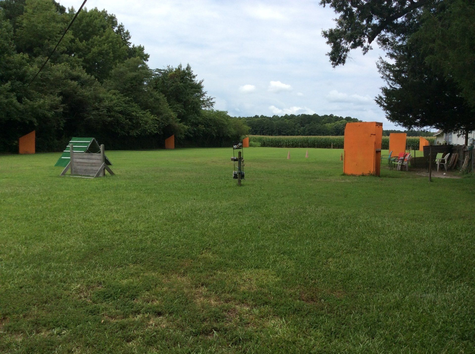 A bicycle is parked in the middle of a grassy field