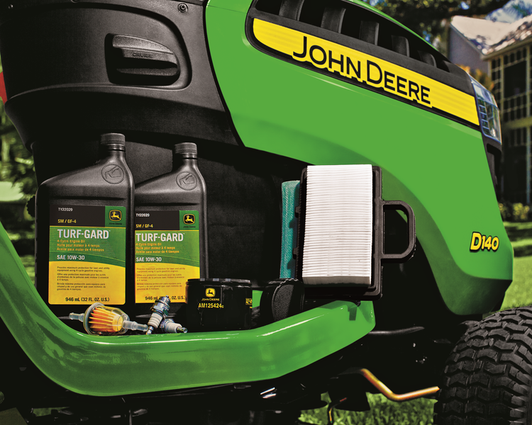 John Deere riding mower with Turf-Gard oil, air filter, spark plugs, and other maintenance items.