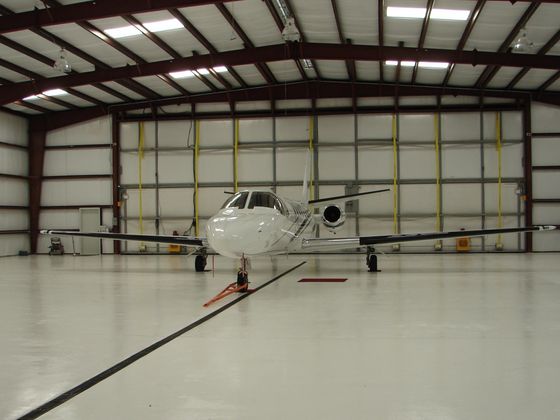 Small aircraft inside a hangar