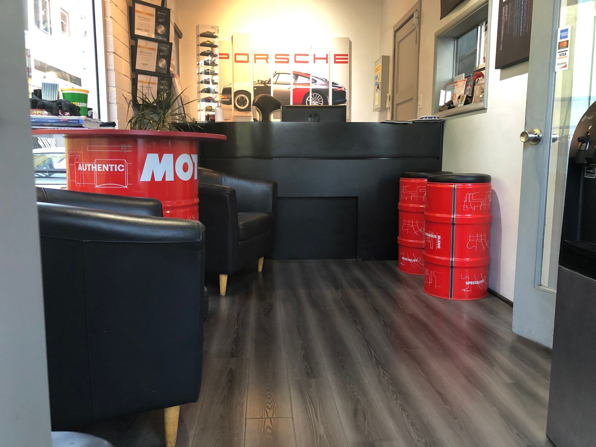 A room with a red barrel that says Motul on it.