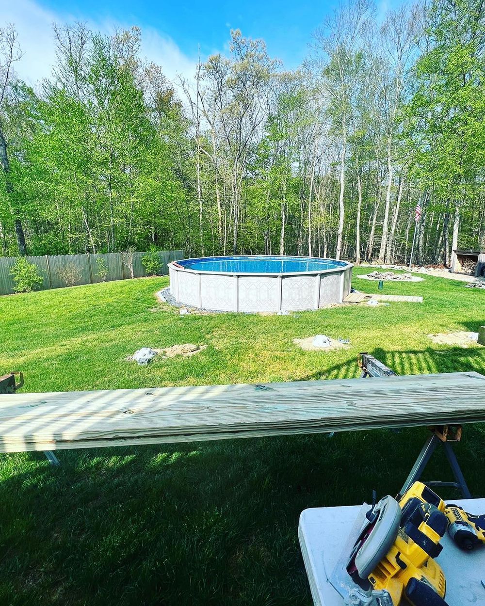 A pool is being built in the backyard of a house