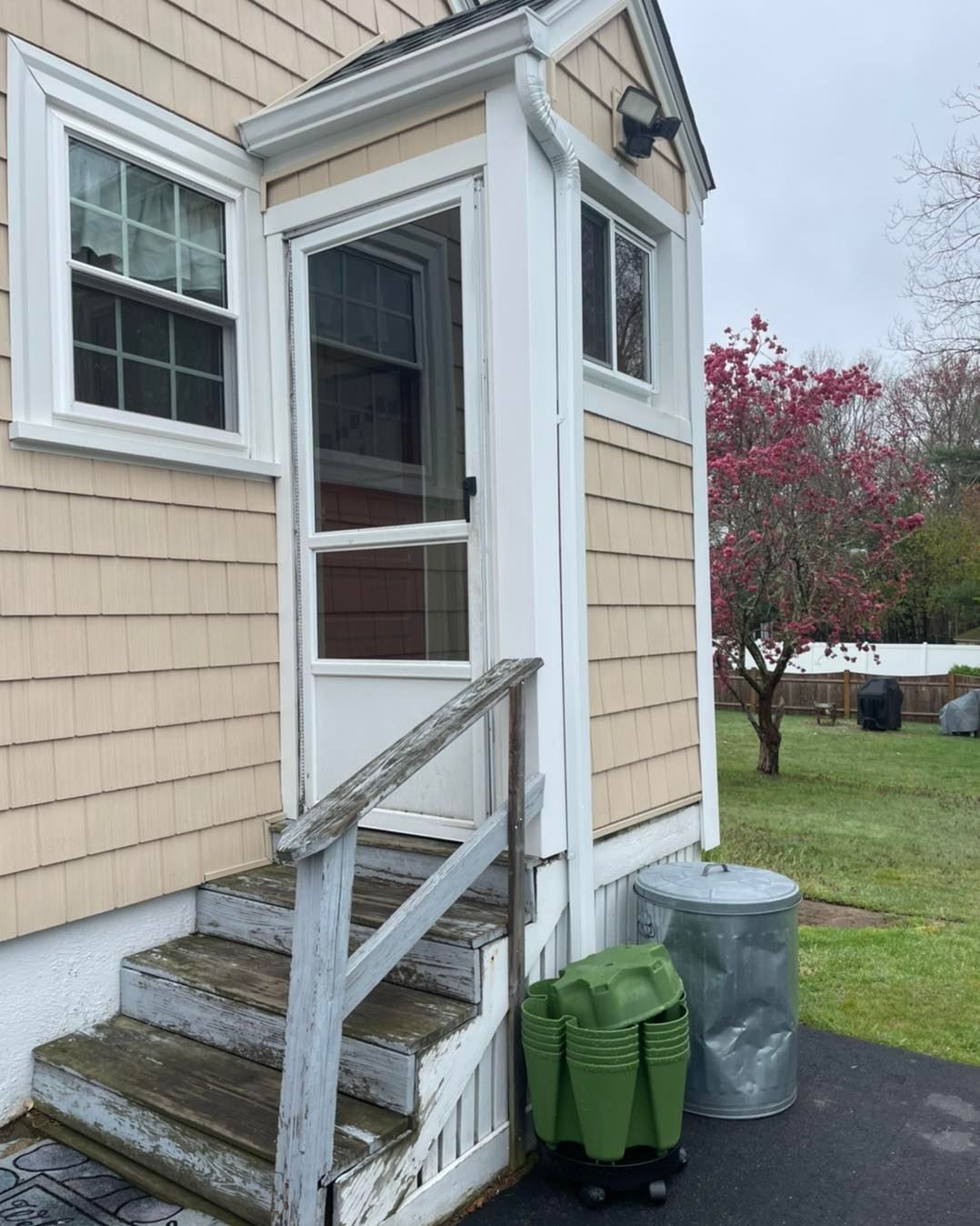 A house with stairs leading up to the front door