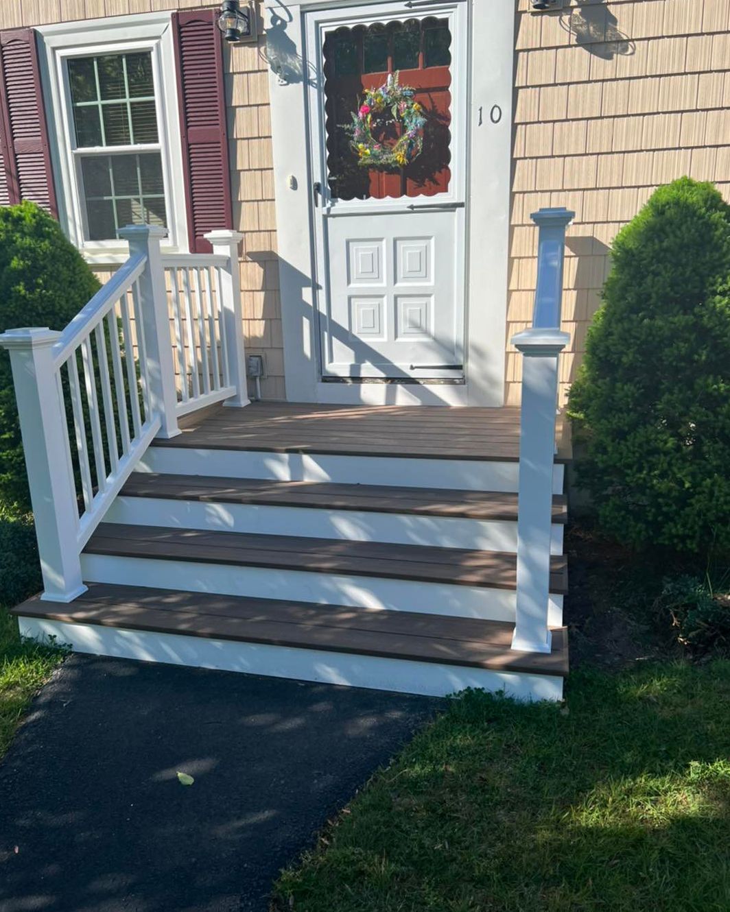 The number 10 is on the front door of a house