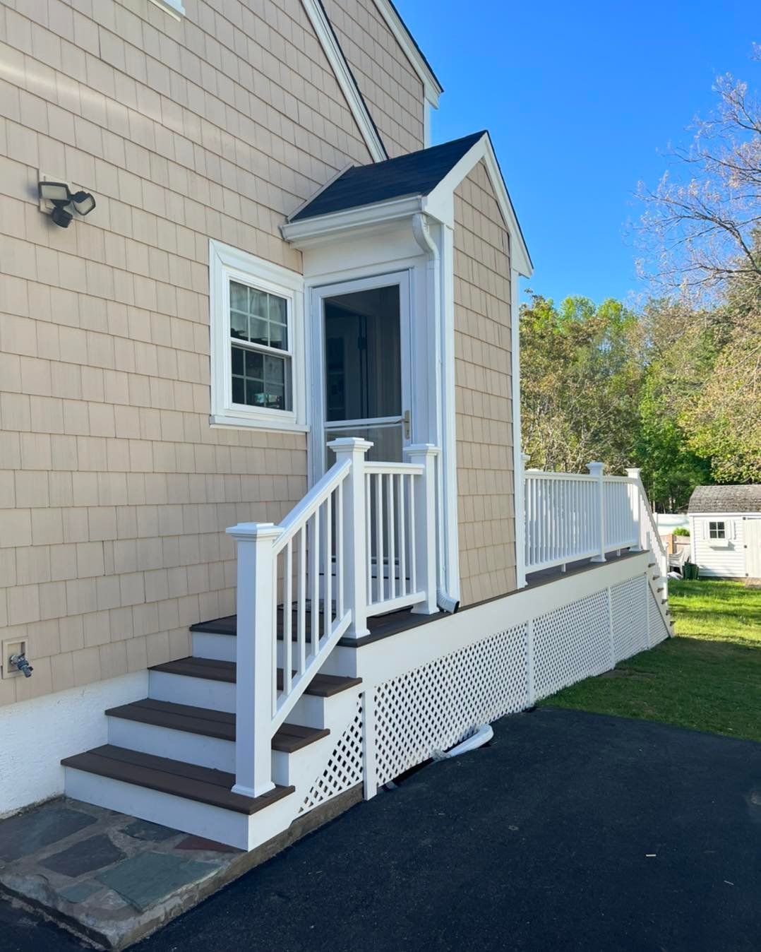 A house with stairs leading up to the front door