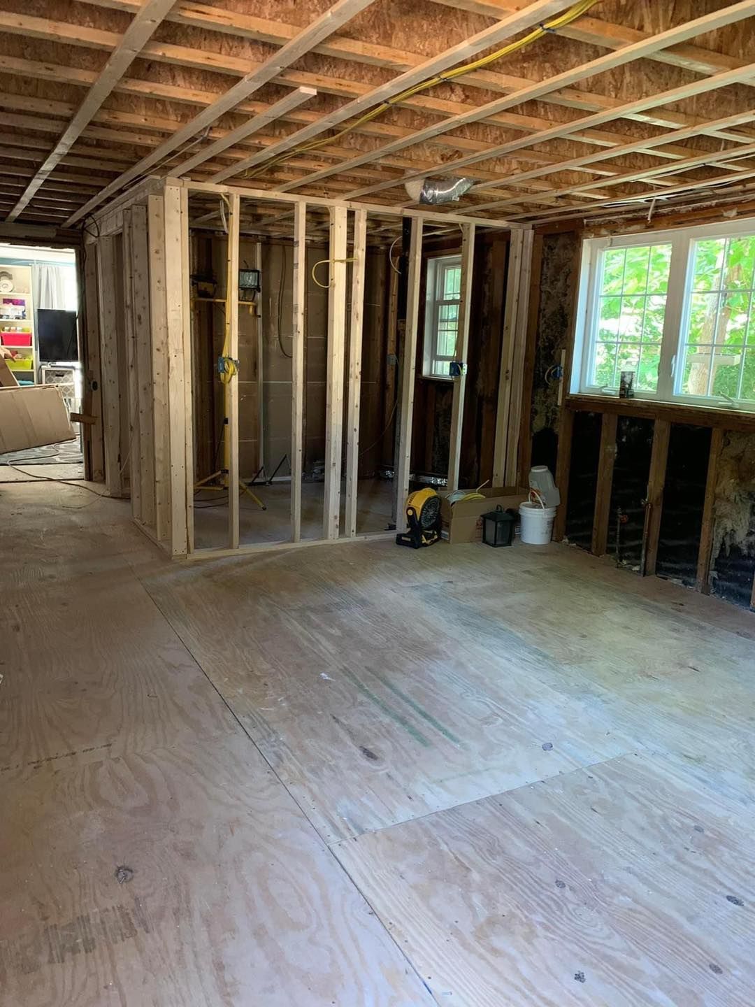 A room with a lot of wooden walls and a wooden floor