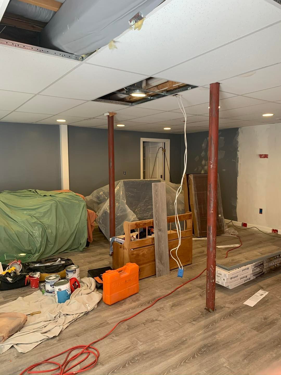 A room that is being remodeled with a hole in the ceiling